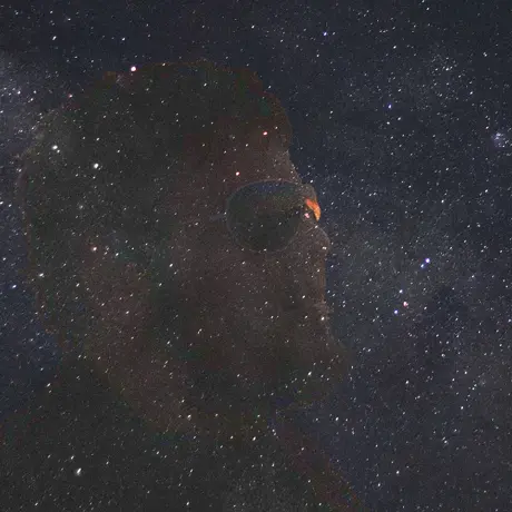 Outline of Emmet's face superimposed on a galaxy of stars